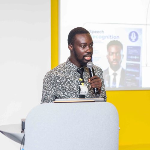 Enoch Ansong speaking during an AI training session