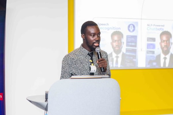 Enoch Ansong speaking during an AI training session